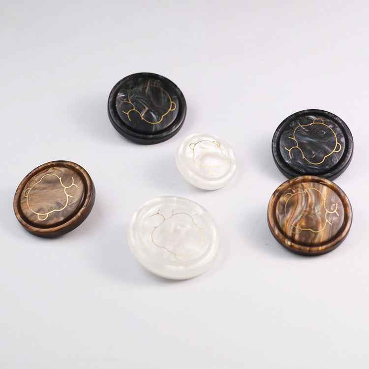 Assorted bear resin shank buttons in white, black, and brown with cartoon outlines