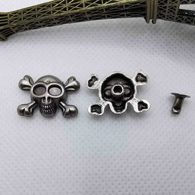 Skull rivets, two designs side by side with visible circular rivet holes and pins