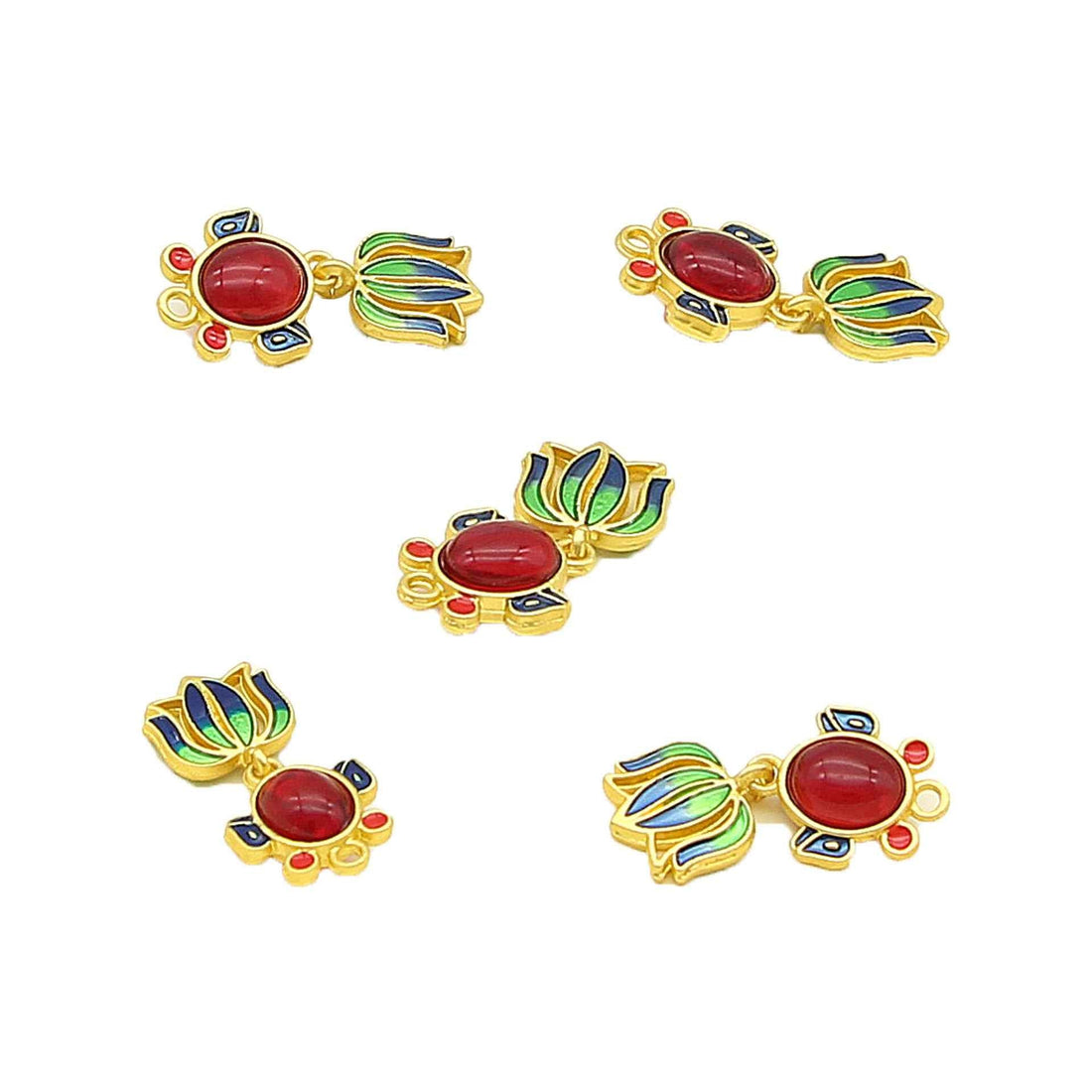 Goldfish-shaped decorative metal button with red oval center, blue/green accents, gold frame