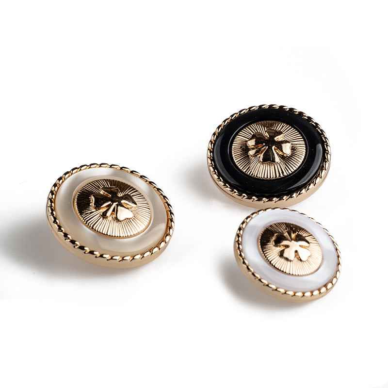Resin buttons: black and white four-leaf clover designs with gold borders