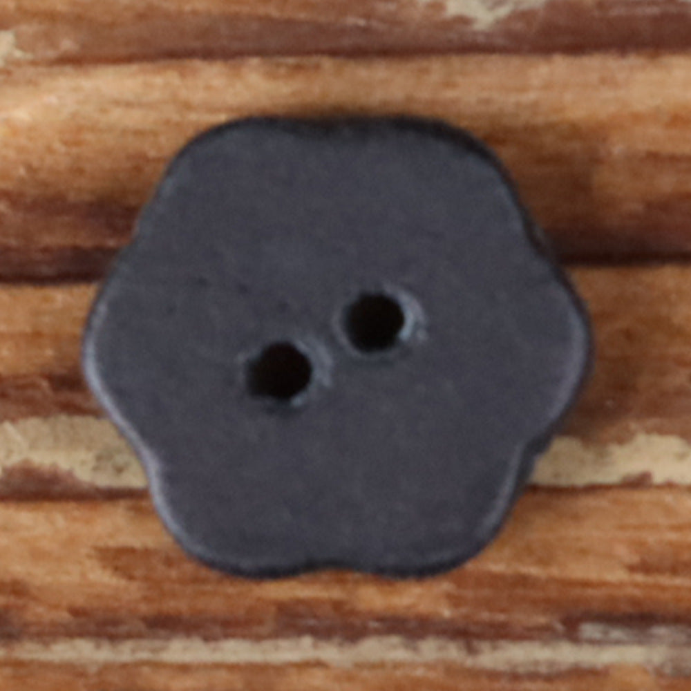 Dark gray novelty shirt button with two holes on a rounded clover shape