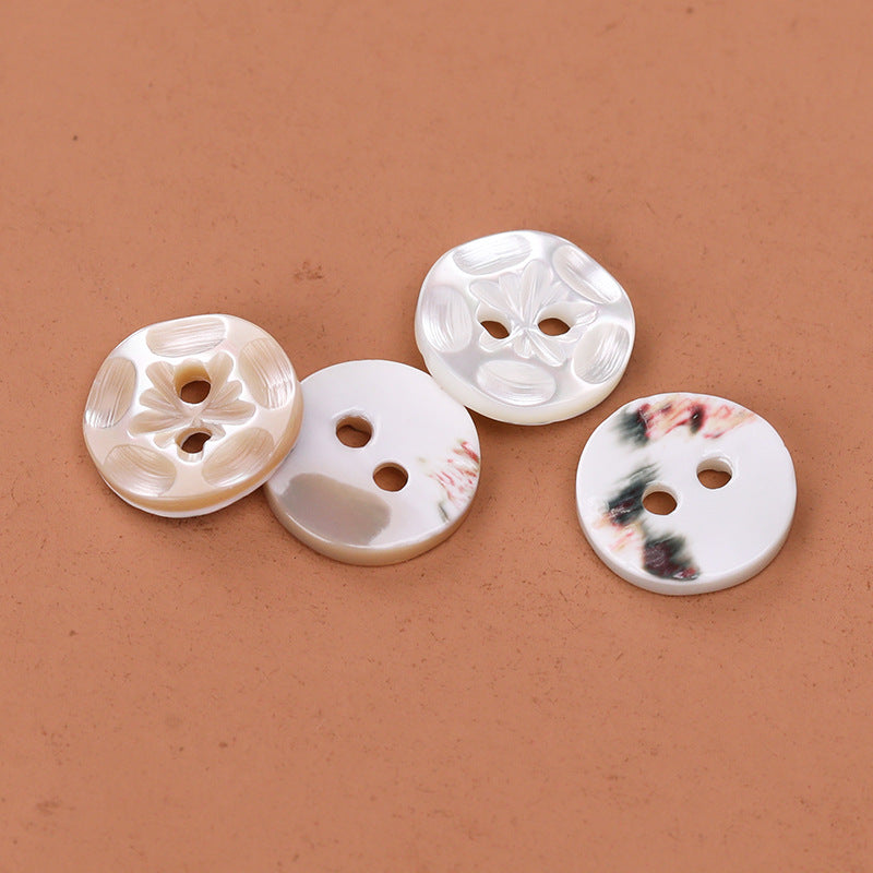 Assorted natural 2-hole troca shell buttons: white and beige, floral embossing