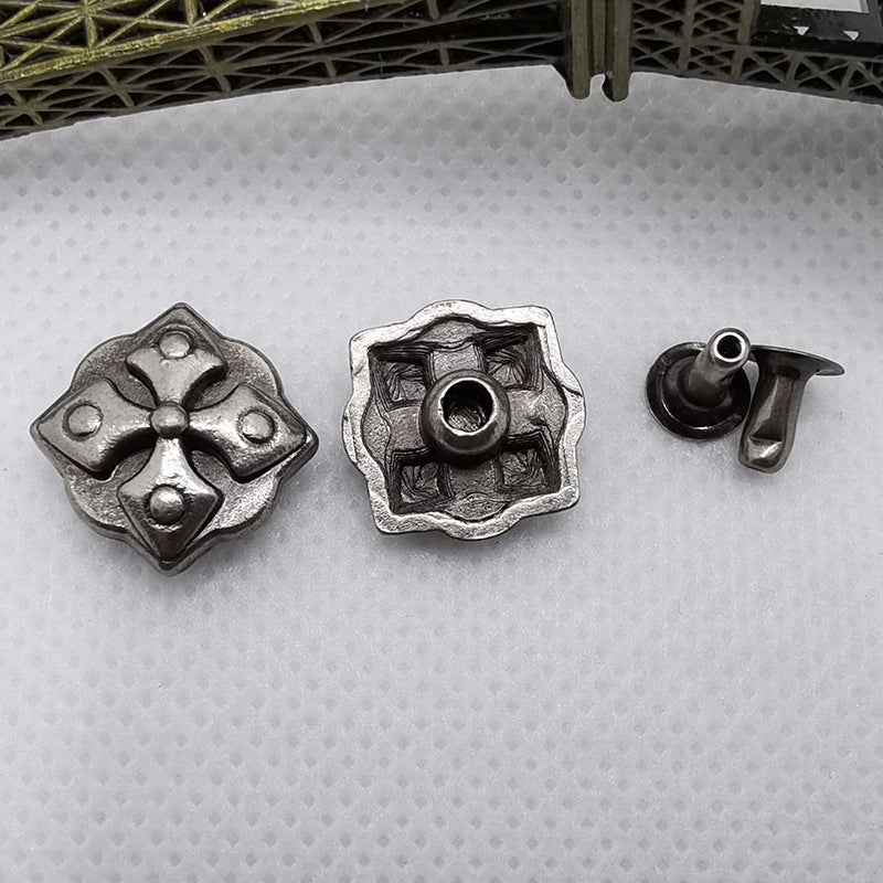 Silver-toned square/diamond rivet studs with cross cutouts, plus one stud back post.