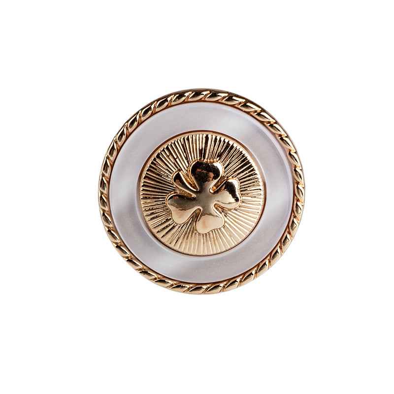 Black resin button with four-leaf clover design, gold border and metal shank