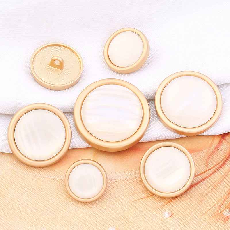 White cat’s eye gemstone shank button with gold rim, round face, 15–28mm