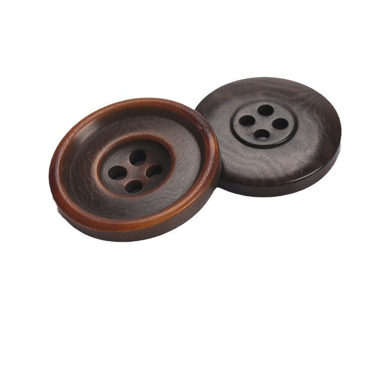 Pair of two-tone round sewing buttons with four holes in dark gray and brown rim