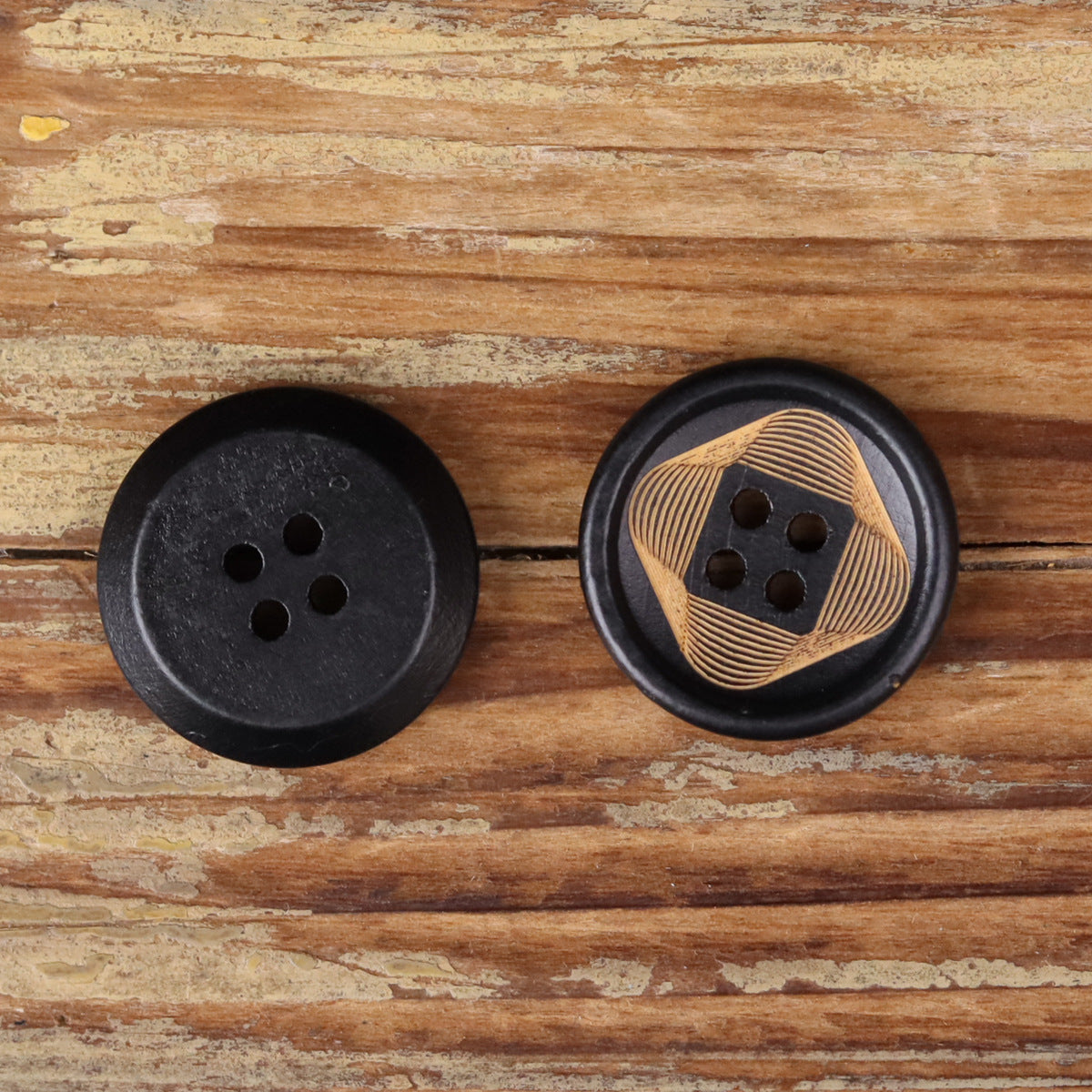 Set of two round 4-hole buttons: one black, one striped wood face on black rim