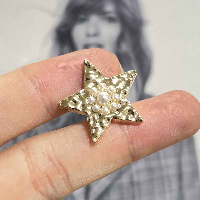 Gold wavy star metal shank button with pearl accents, single piece