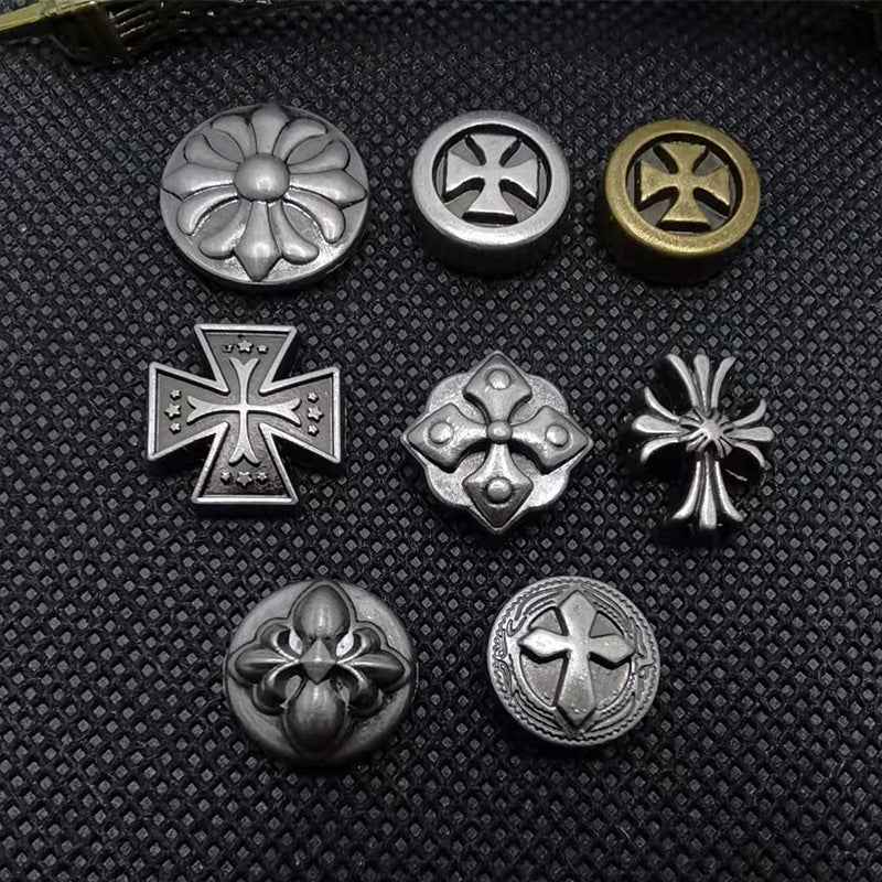 Vintage silver round rivet stud buttons with cross motifs, mix of disc and stud backs.