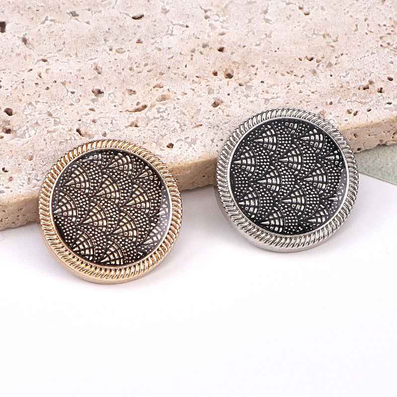 Fish-scale enamel shank buttons, gold and silver rims, black patterned fronts
