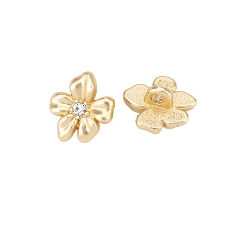 Sand gold crystal flower metal shank button, front view with clear center