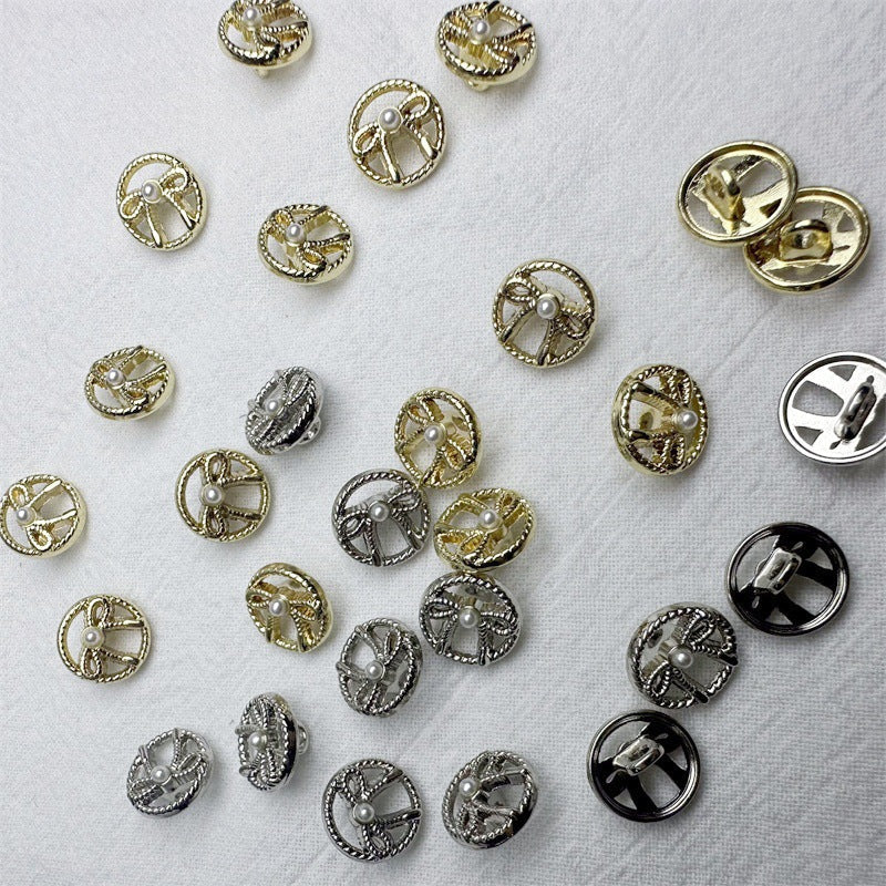 Assorted gold and silver metal shirt buttons with hollow bow design and faux pearl centers