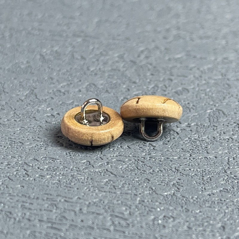 Round natural wood shank buttons with metal loop shanks, cross-engraved details