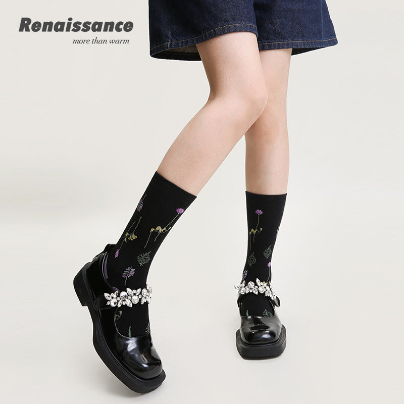 Black embroidered floral mid-calf socks with vine pattern and ankle embellishment