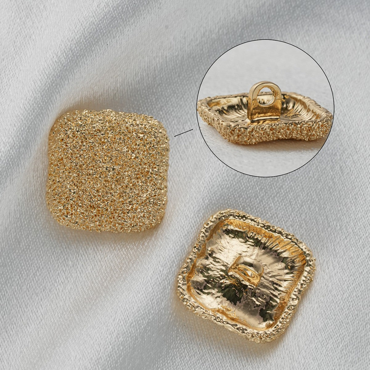 Gold square textured metal shank button with visible attachment loop