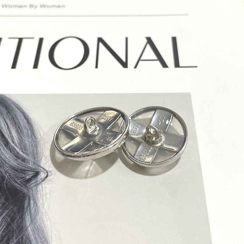 Pair of silver round buttons, central crystal cross and metal shank