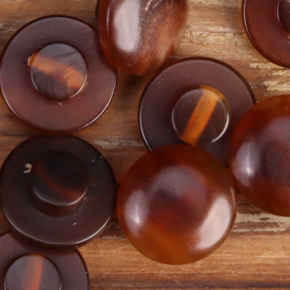 Set of round horn buttons in dark brown tones, domed fronts with natural swirls