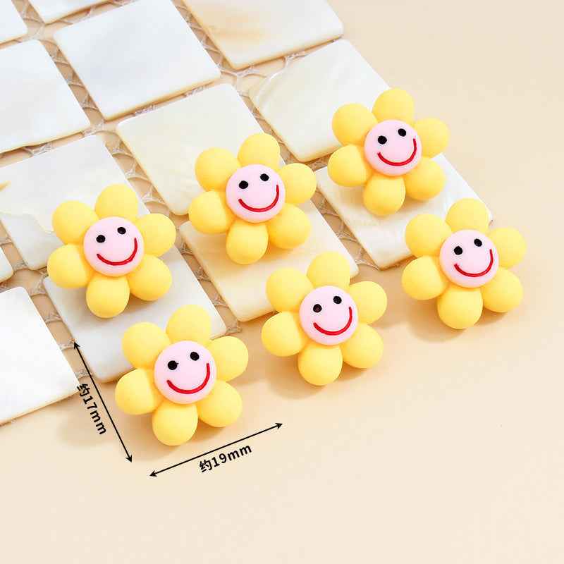 Yellow smiley flower plastic buttons with metal shanks, about 19mm size