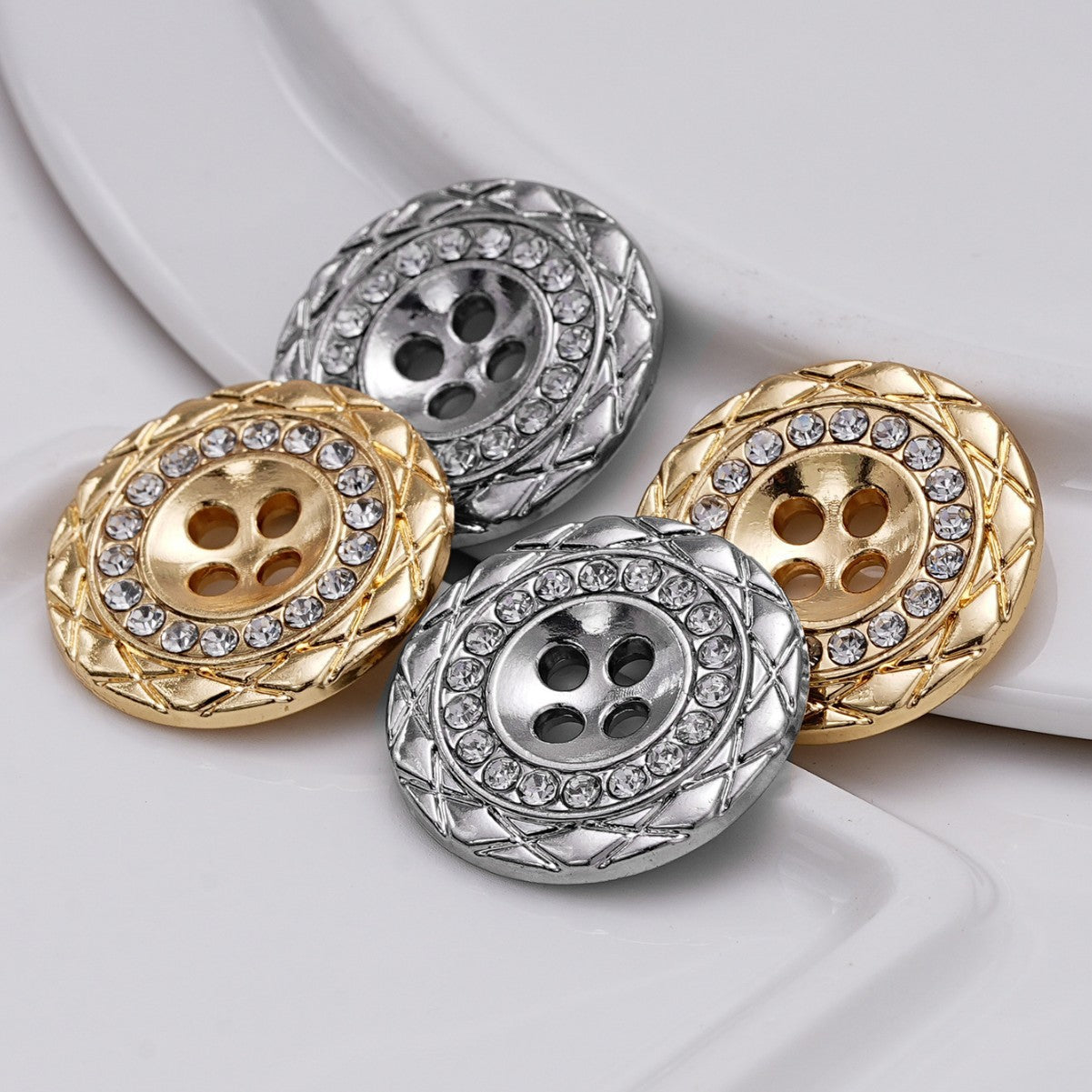 Assorted gold and silver 4-hole rhinestone buttons with ornate metal border