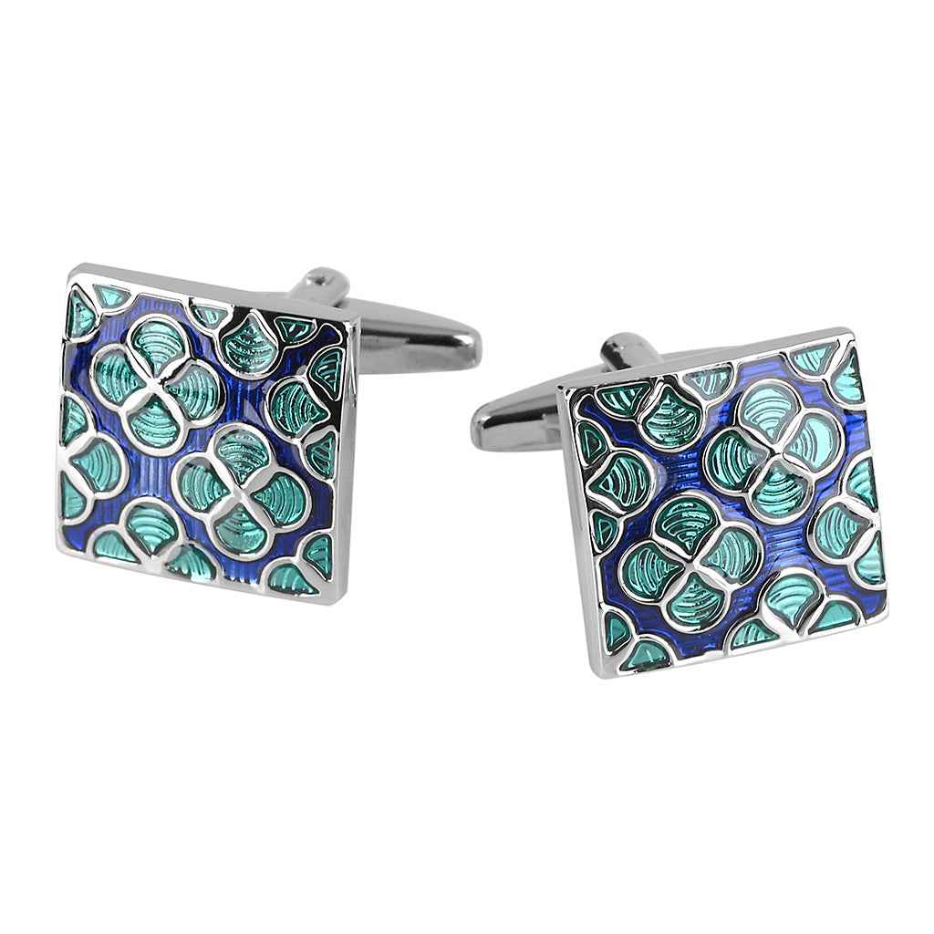 Square enamel cufflinks with blue background and green floral pattern, silver frame.