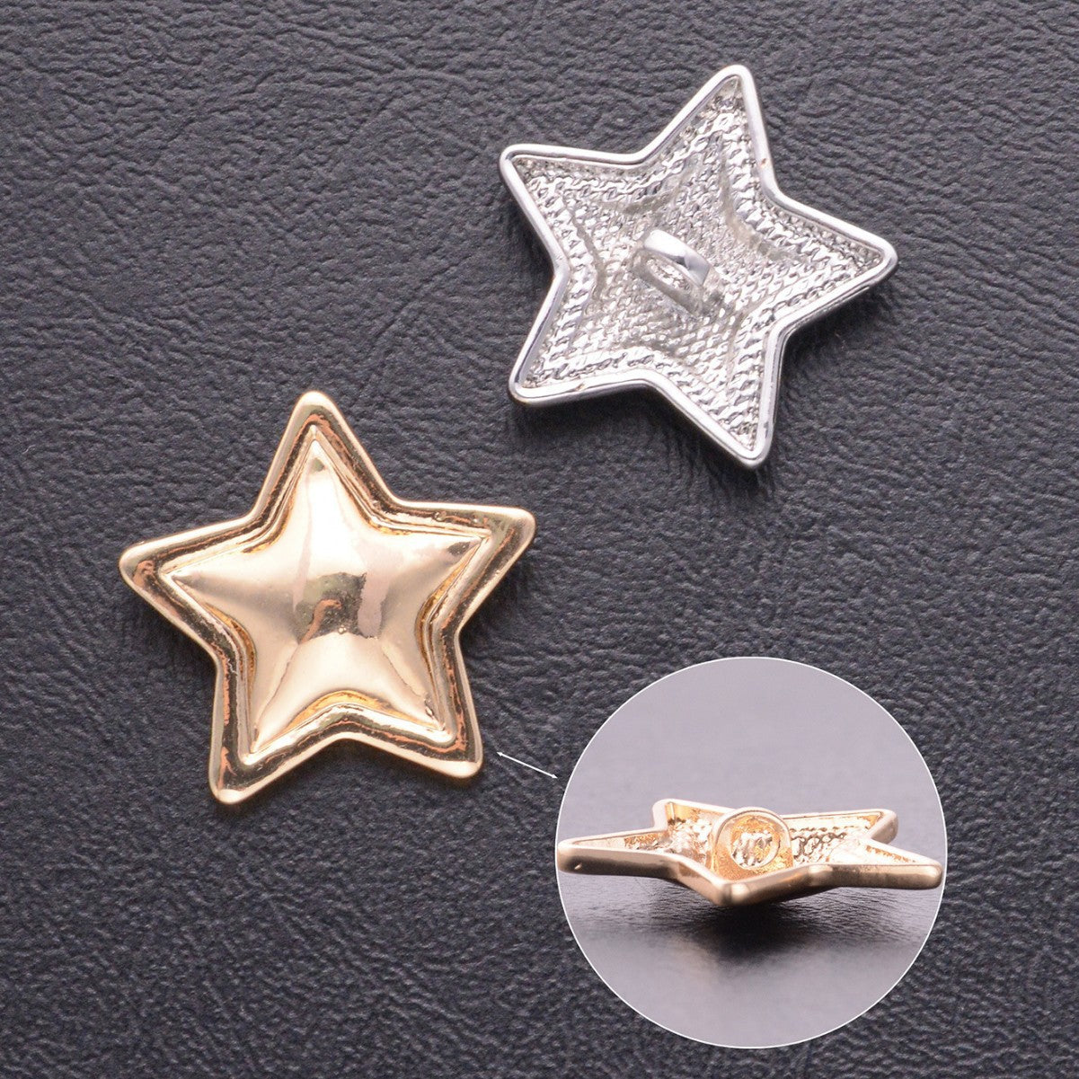 Gold and silver star-shaped metal shank button close-up with side shank detail