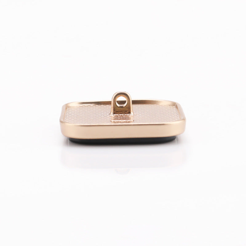 White marble square button back with central shank, gold metal frame