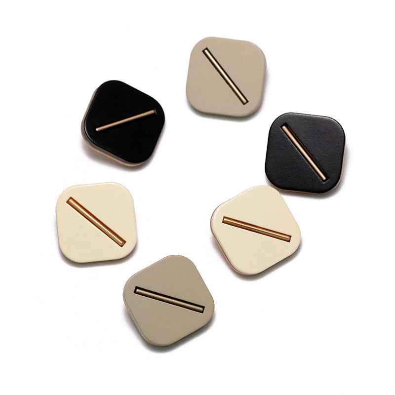 Assorted square resin shank buttons in black, cream, and tan tones, bar slot