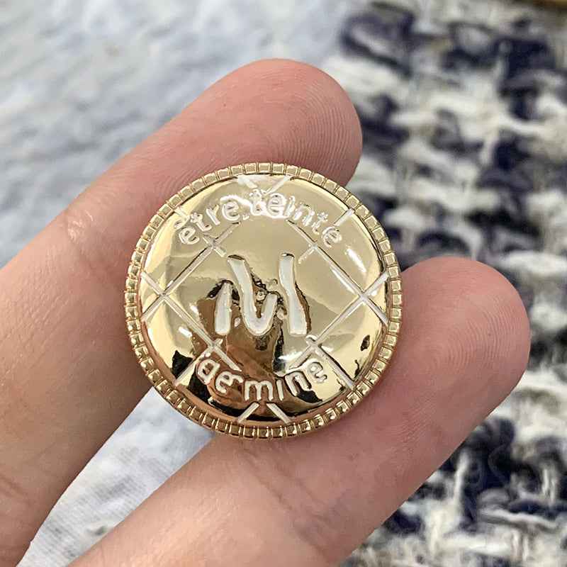 Gold round metal M-letter button, engraved center, beaded edge