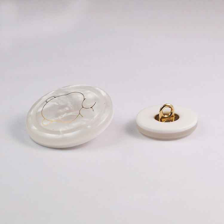White bear resin shank button with metal loop shank visible