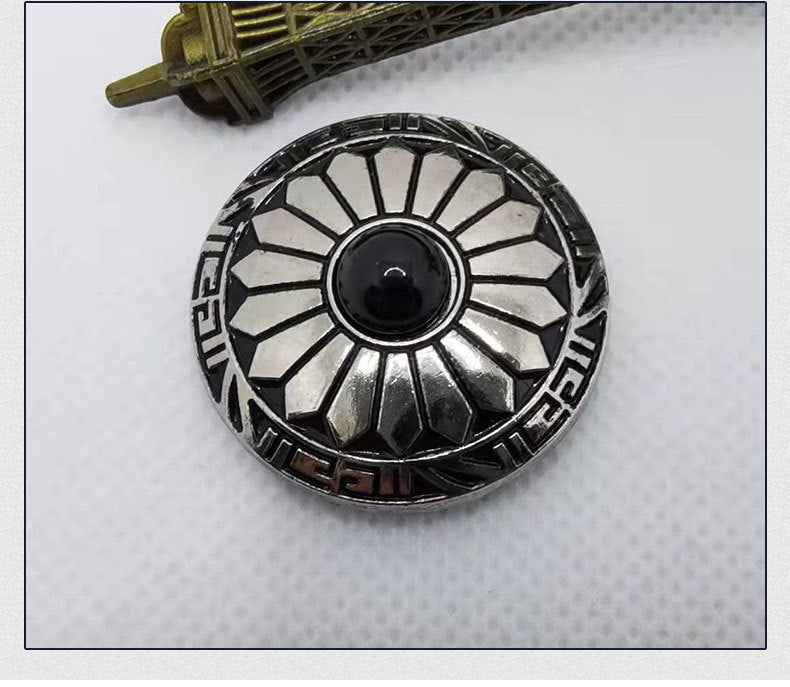 Black cabochon round alloy button with black-and-silver sunburst pattern and rim details