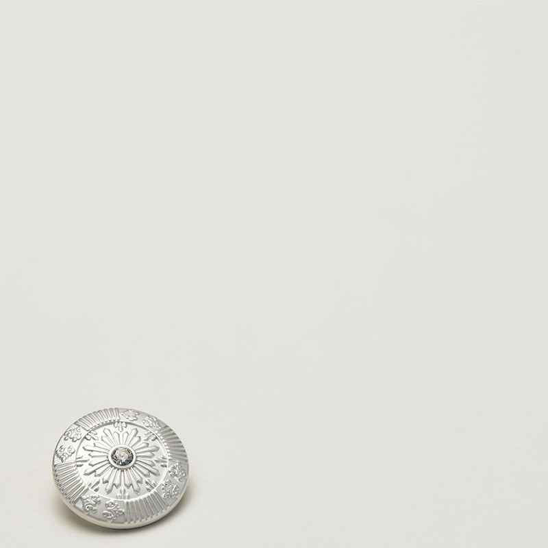 Frosted metallic sun shank button, light gold tone with crystal center, front view
