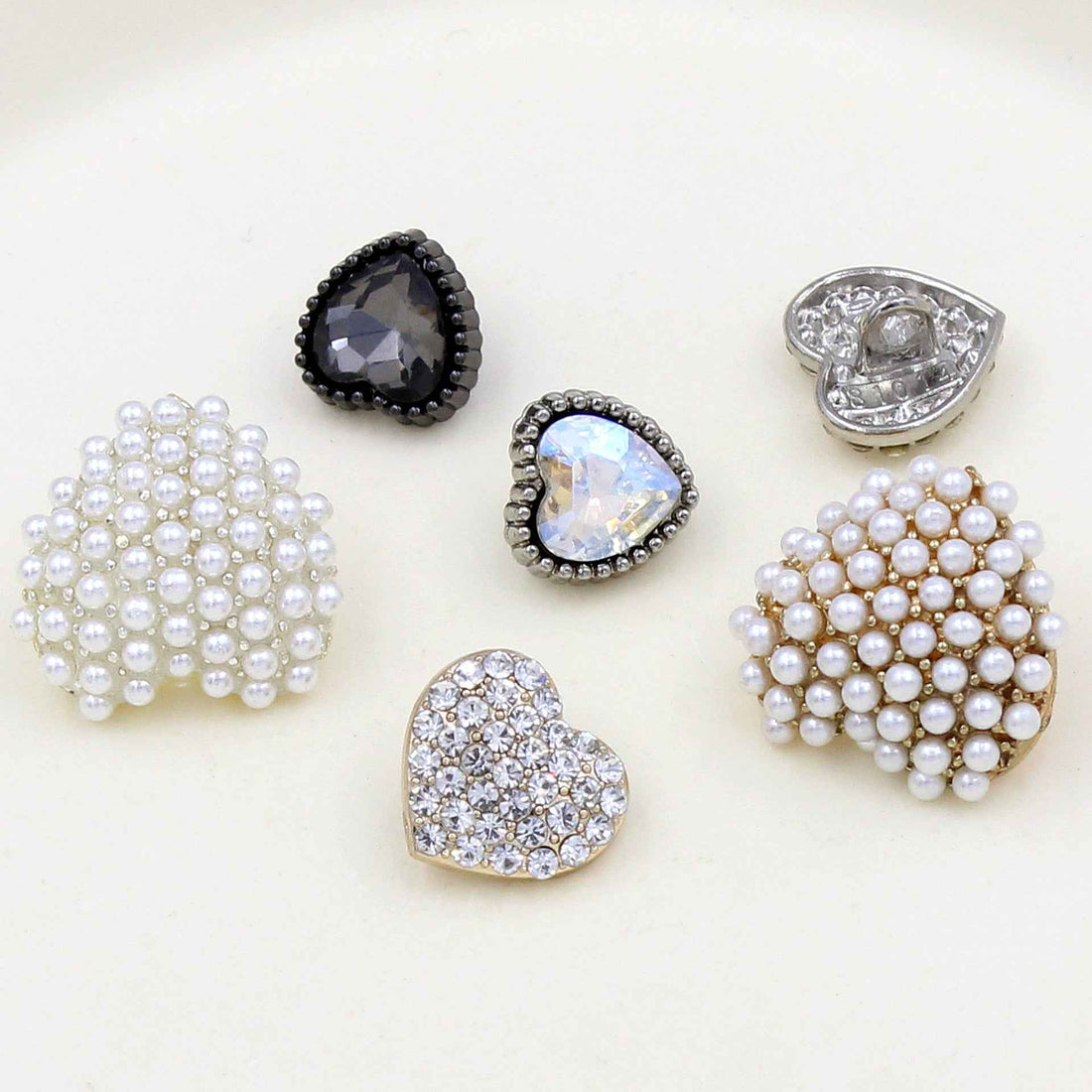 Heart-shaped rhinestone buttons set with faux pearls and faceted stones, assorted colors