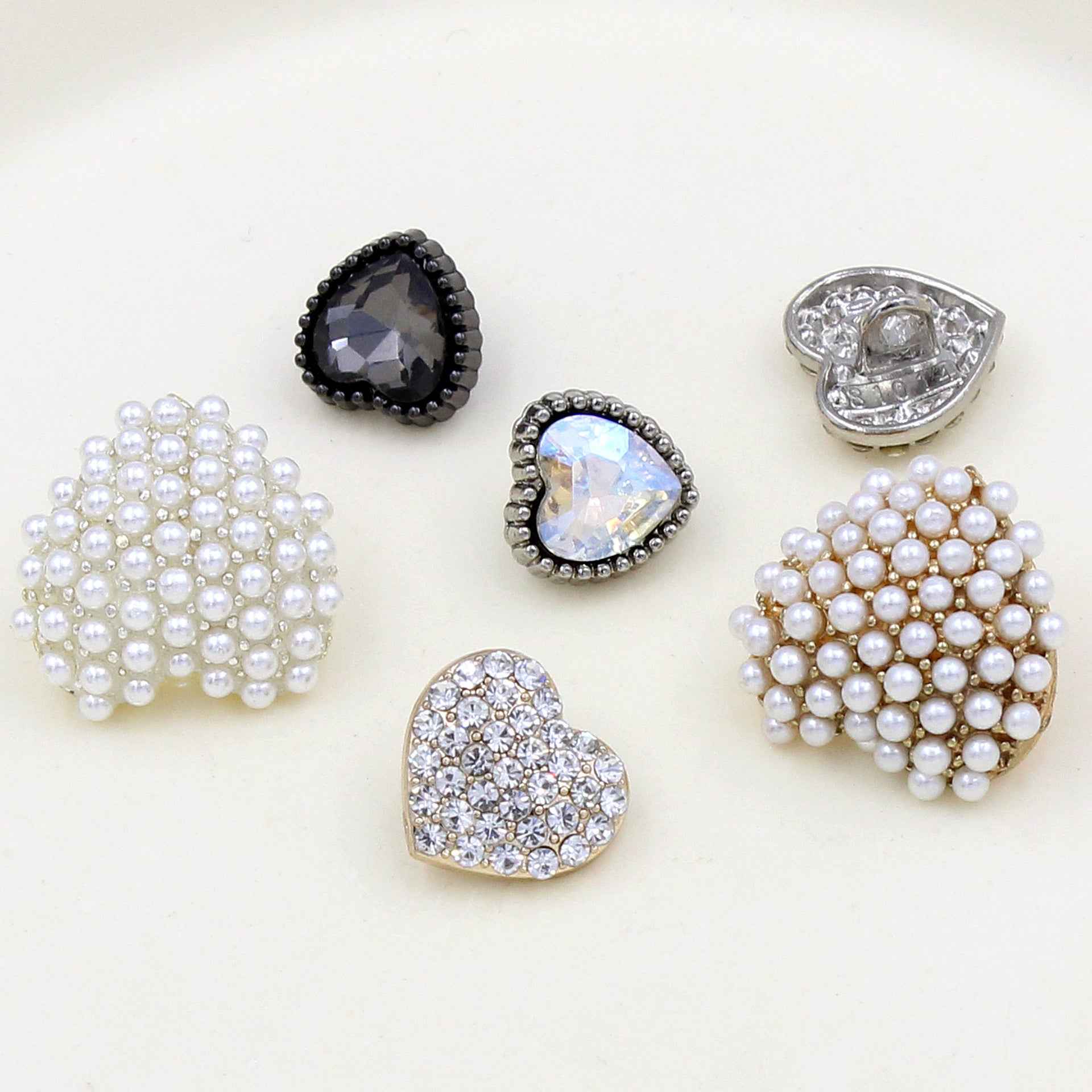 Heart-shaped rhinestone buttons set with faux pearls and faceted stones, assorted colors
