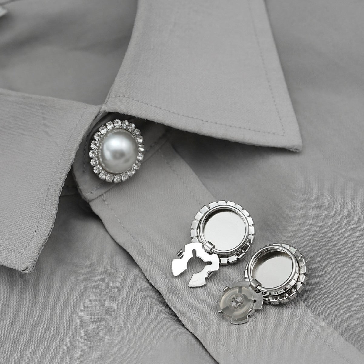 Pearl rhinestone snap button on shirt collar with metal clamp backing