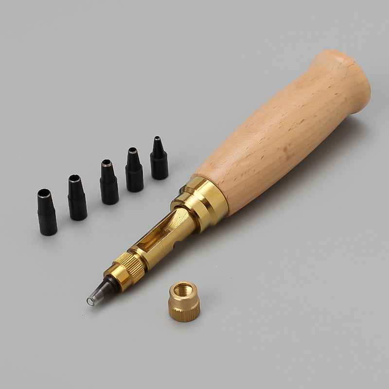 Wood-handled leather belt hole punch tool with spare black punch tips