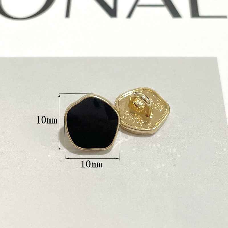 10mm metal shank button with black pearl-look front and gold back