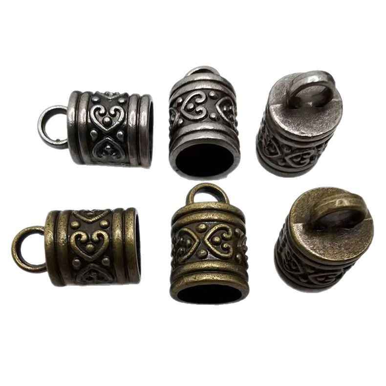 Antique metal cylinder bell end caps set, silver and bronze finishes with ornate patterns