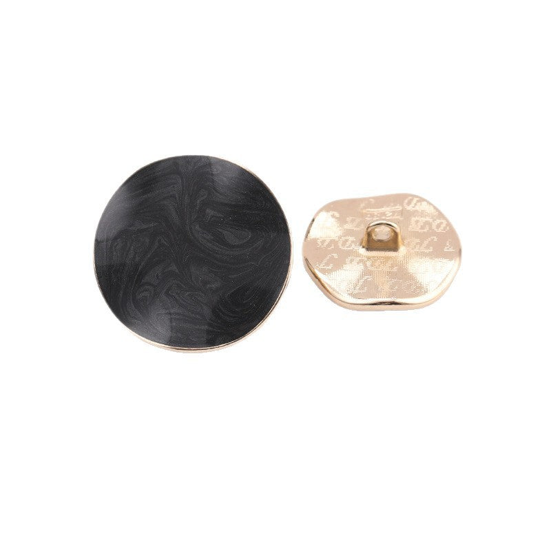 Black irregular dot oil coat button with metal shank; front and back view