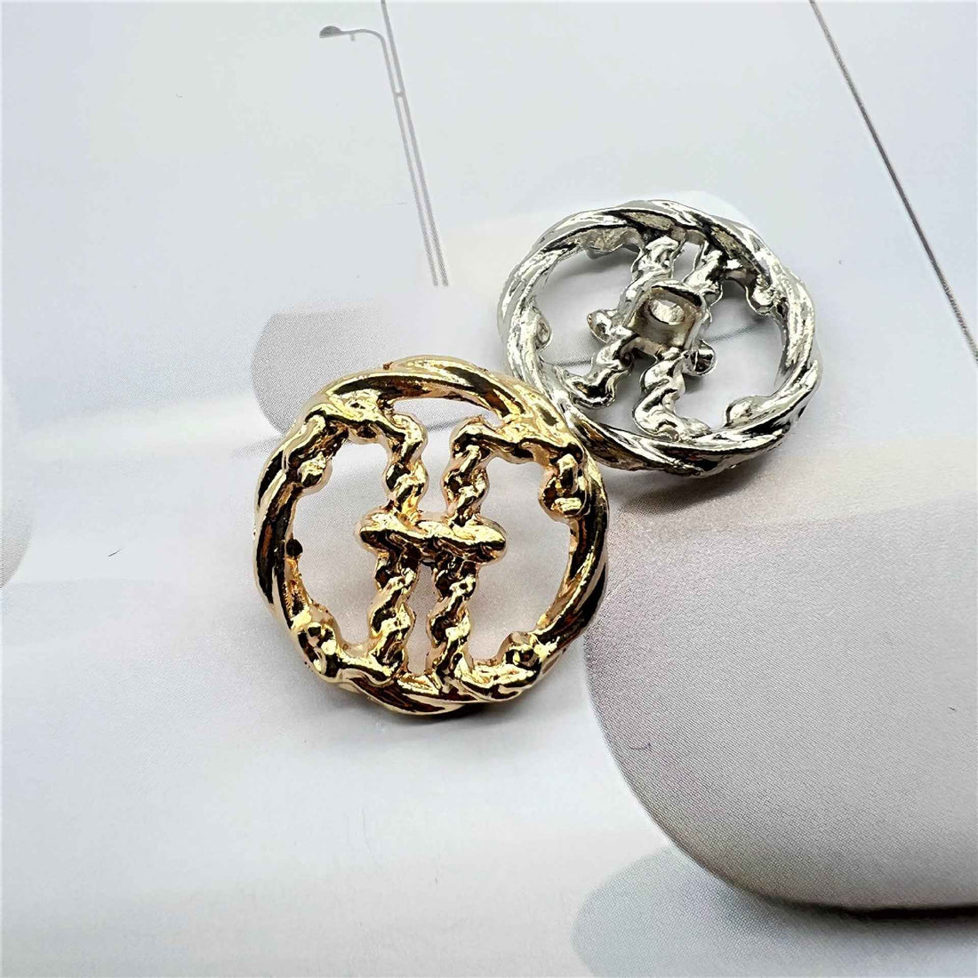 Vintage metal sewing buttons with raised H initial, gold and silver on card