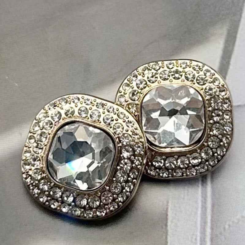 Shank buttons with clear/gray faceted gems in gold-tone and silver-tone round settings (2 pcs)
