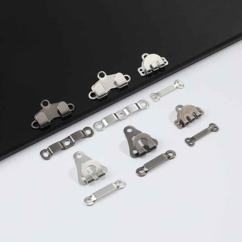 Metal trouser hook fastener set, silver-tone pieces with loops and snap ends