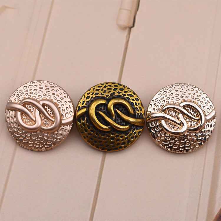 Round coat buttons with decorative swirl front, two-tone antique metal finish