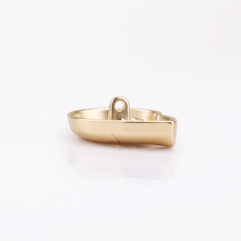 Light gold snail-shaped metal shank button, side profile with thread shank