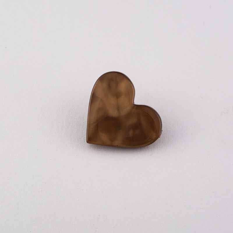 Black flat heart button with metal shank, glossy front