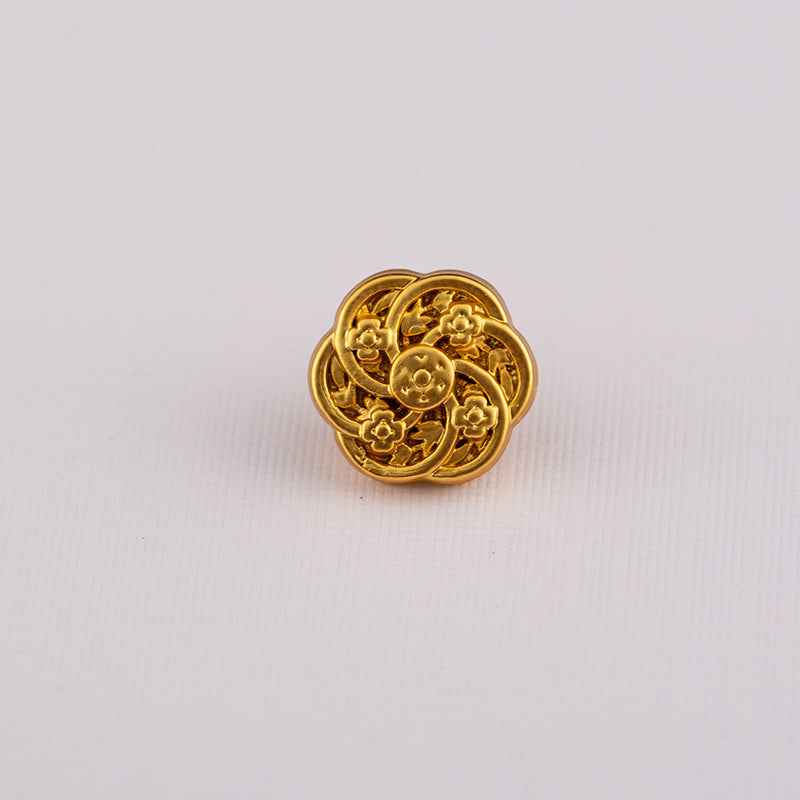 Gold Chinese-style shirt button with ornate circular scrollwork and animal motif