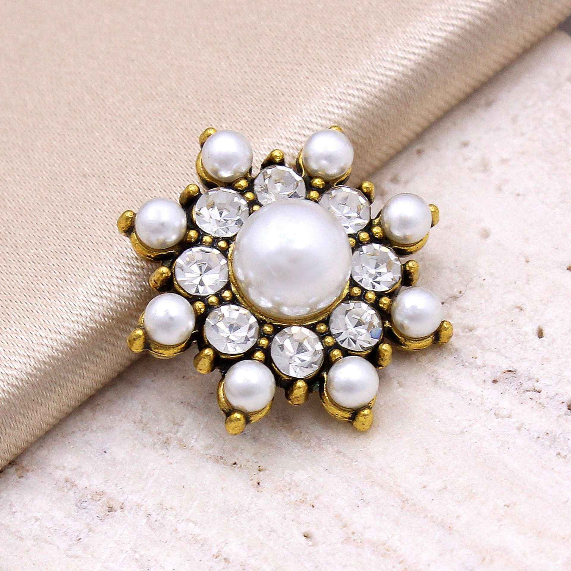 Gold-tone star-shaped pearl crystal button with central pearl, clear stones, and small pearls
