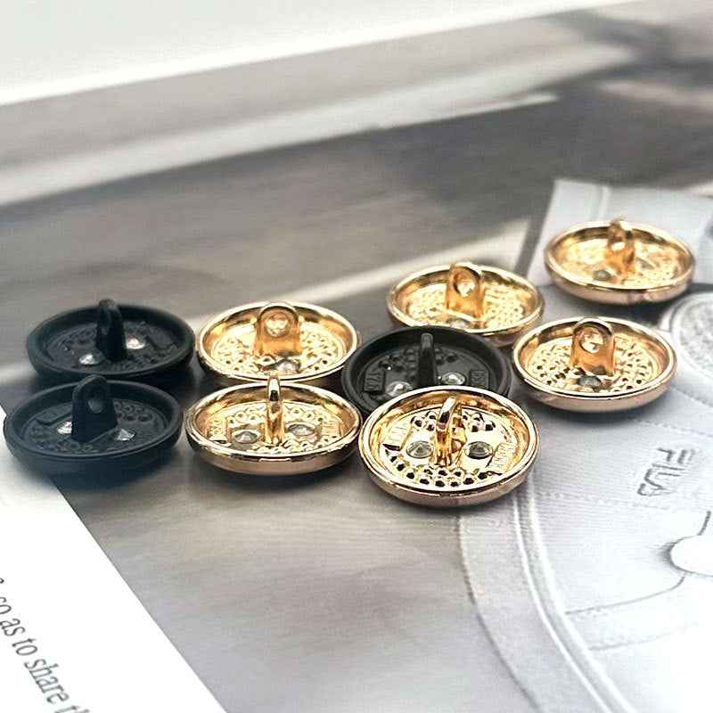 Round two-tone metal shank buttons set, gold backs with front black button tops