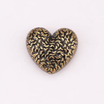 Heart-shaped textured metal shank button, antique gold with scale pattern