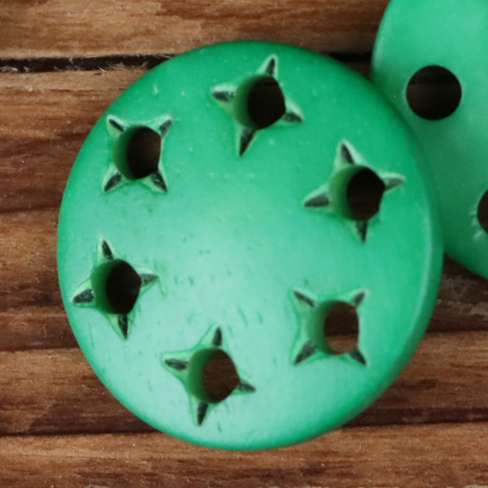 Green star-cutout horn shank button with metal shank and star-shaped cutouts
