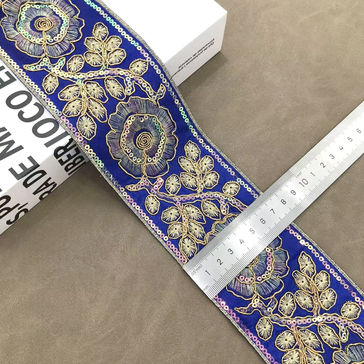 Blue floral embroidered trim with rosette blooms, bead accents, measured width 7.5 cm